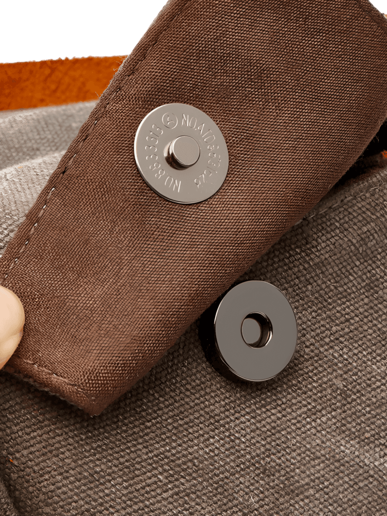 Men's toiletry bag in canvas and leather inserts with magnetic button details