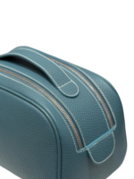 Trousse de maquillage toilette femme en cuir en couleur bleu turquoise avec zip et poignée pratique pour le voyage Trousse de maquillage toilette femme en cuir en couleur bleu turquoise avec zip et poignée pratique pour le voyage
